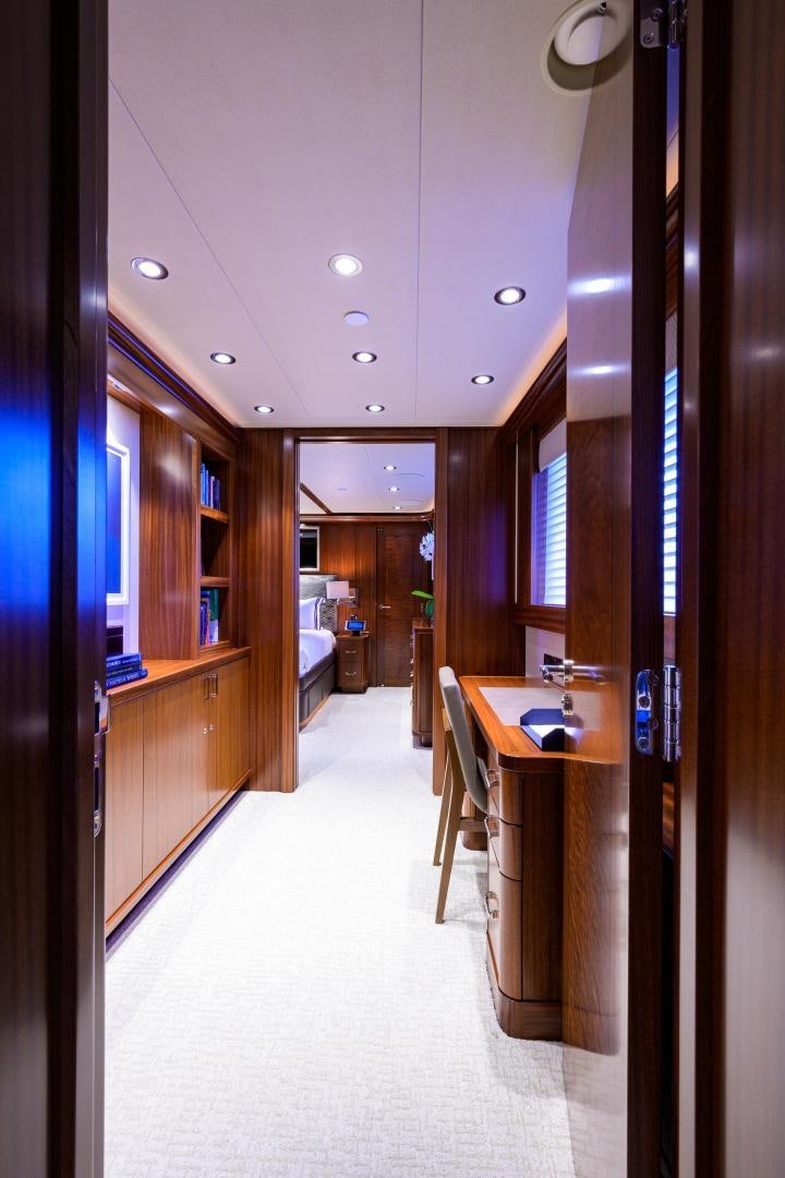 a hallway with a table and chairs aboard LADY JJ Yacht for Sale