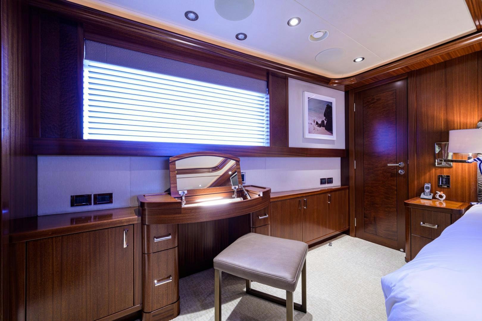 a bedroom with a bed and a sink aboard LADY JJ Yacht for Sale