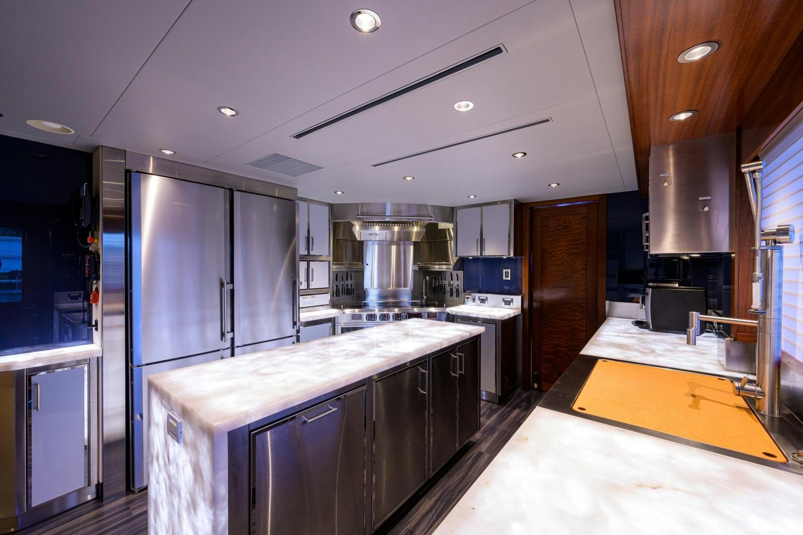 a kitchen with a large island aboard LADY JJ Yacht for Sale
