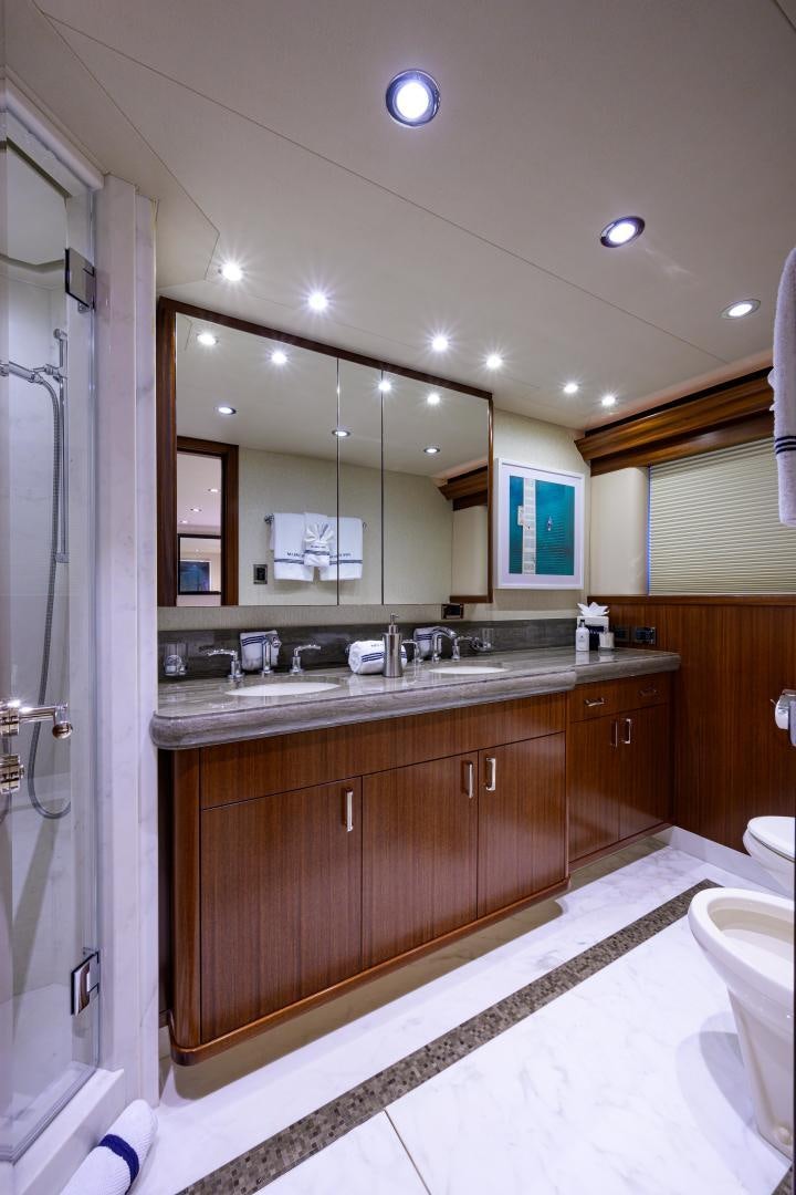 a bathroom with a large mirror aboard LADY JJ Yacht for Sale
