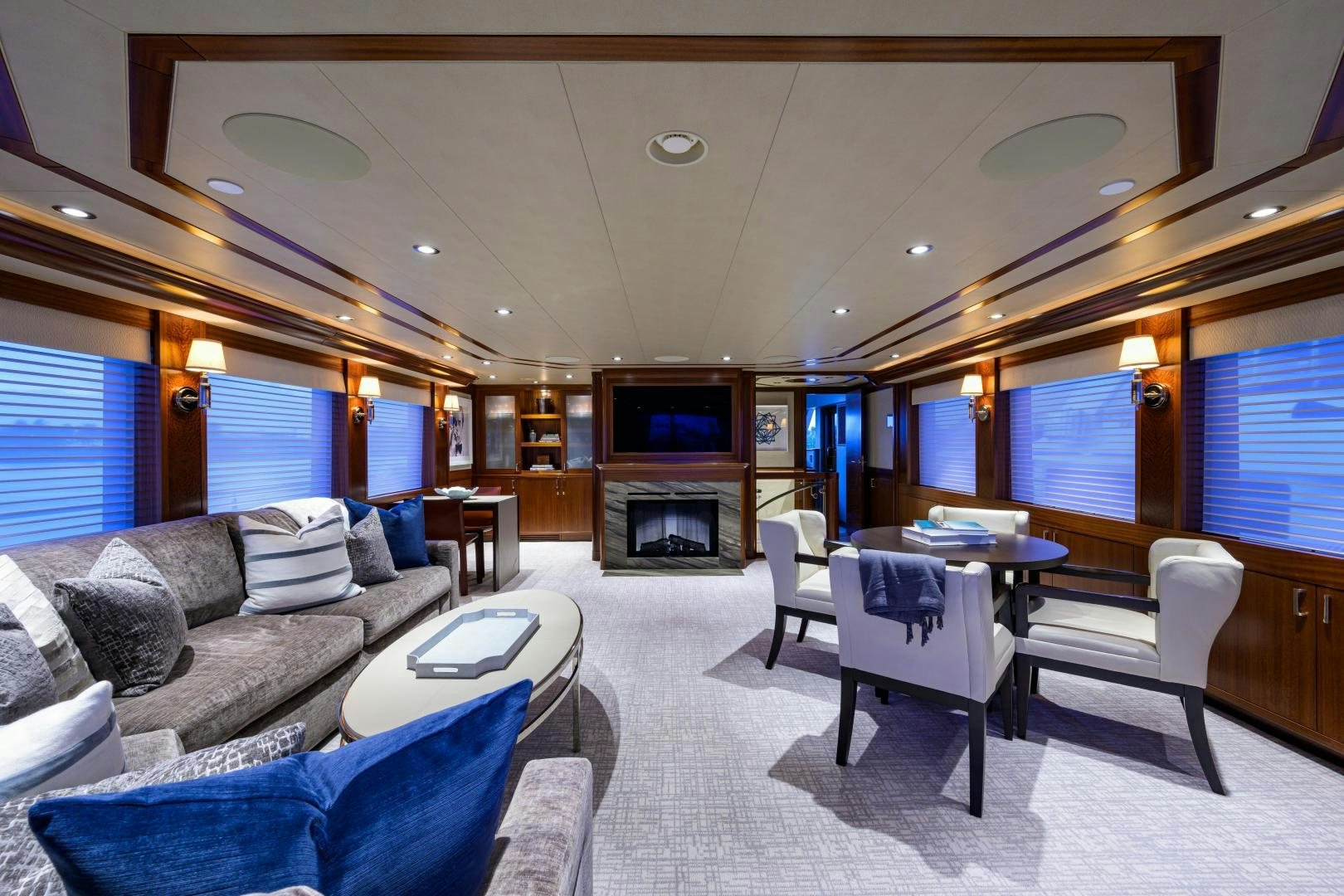 a living room with a fireplace aboard LADY JJ Yacht for Sale