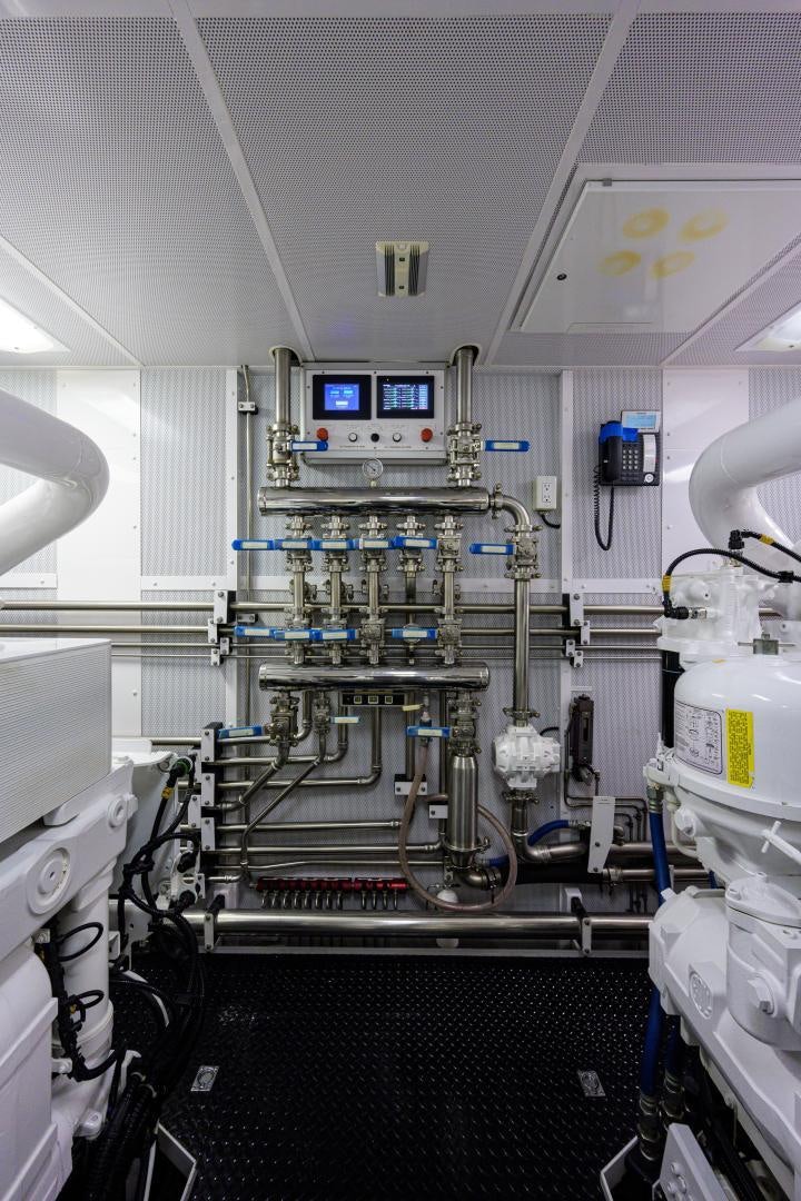 a room with a machine aboard LADY JJ Yacht for Sale