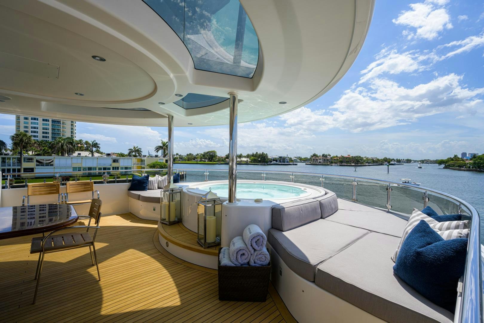 a room with a large balcony overlooking a body of water aboard LADY JJ Yacht for Sale