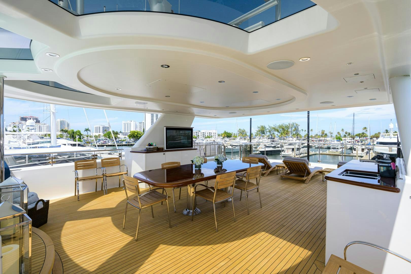a room with tables and chairs aboard LADY JJ Yacht for Sale