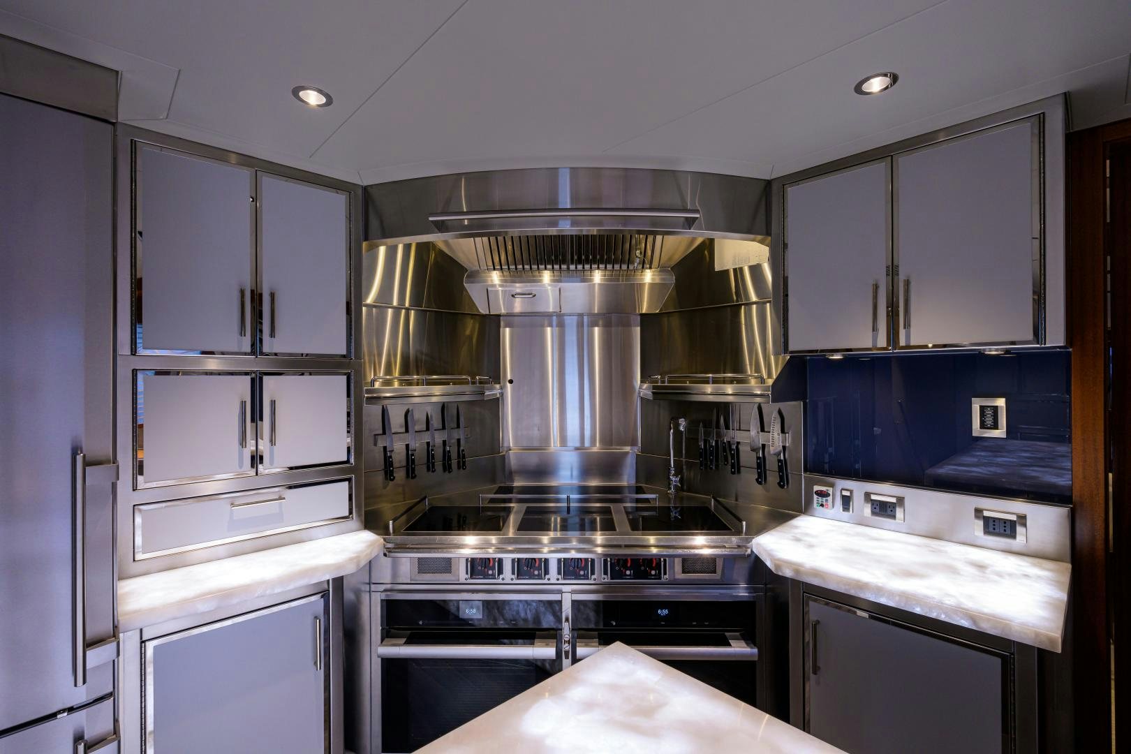 a kitchen with a stainless steel stove aboard LADY JJ Yacht for Sale
