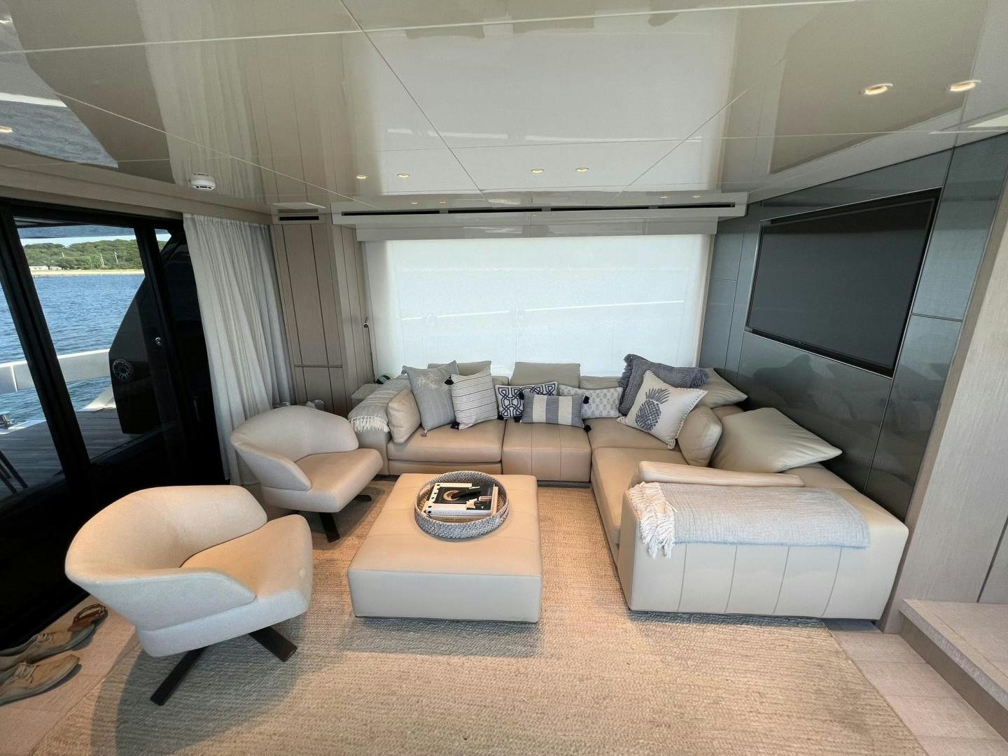 a living room with a couch and a table aboard Twenty One Yacht for Sale