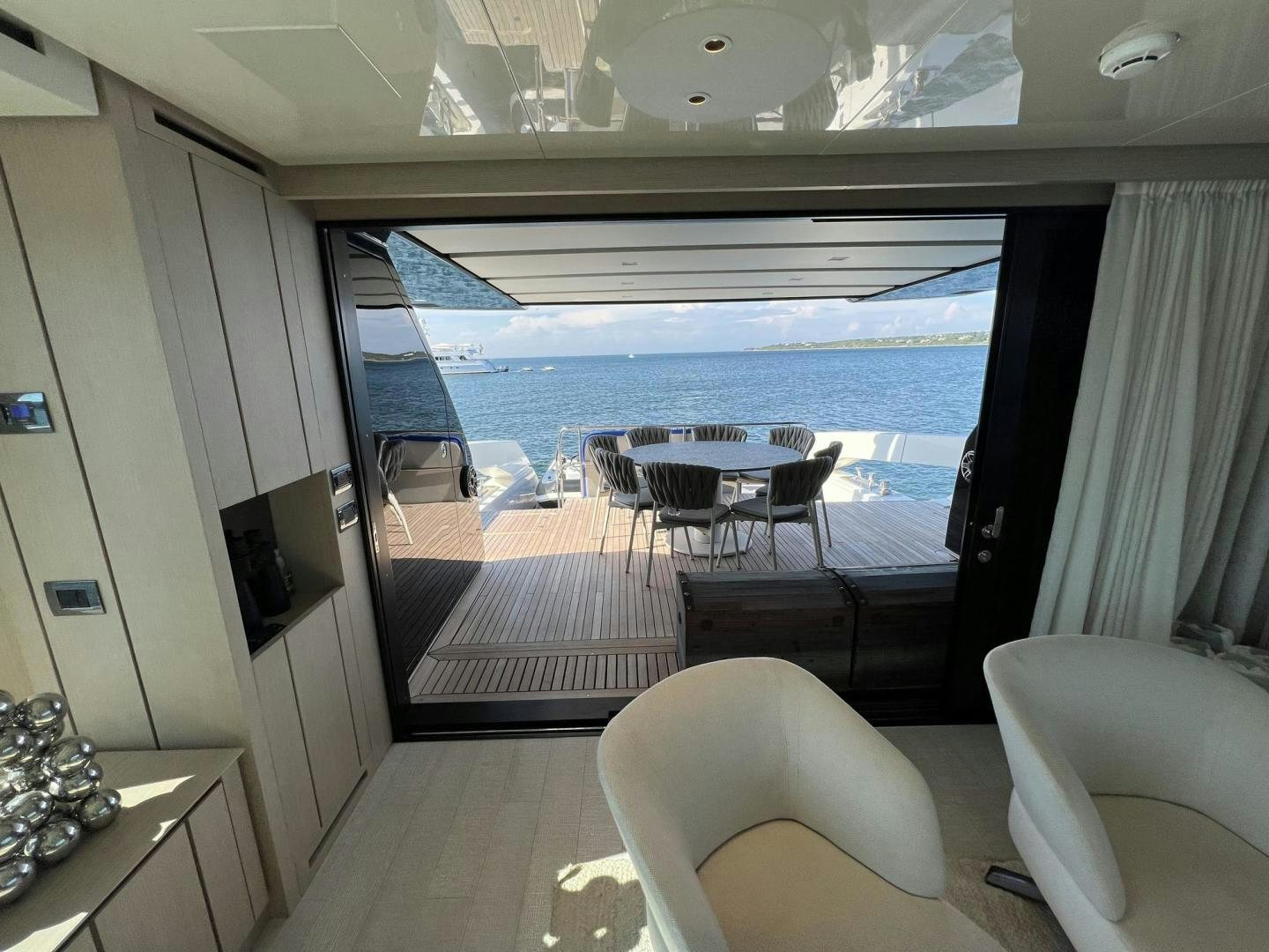 a room with a table and chairs aboard Twenty One Yacht for Sale