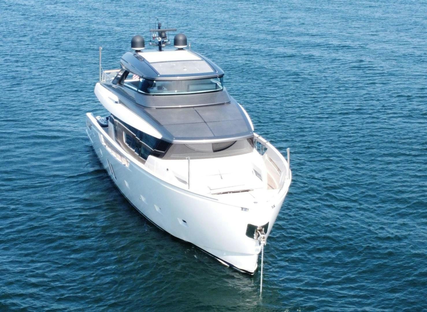 a white boat in the water aboard Twenty One Yacht for Sale