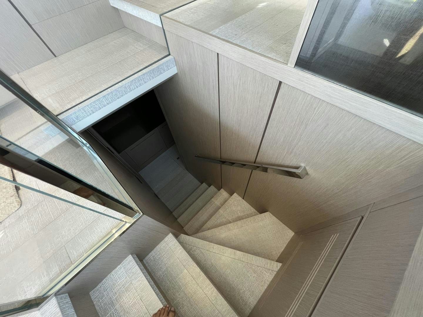a close-up of a white staircase aboard Twenty One Yacht for Sale