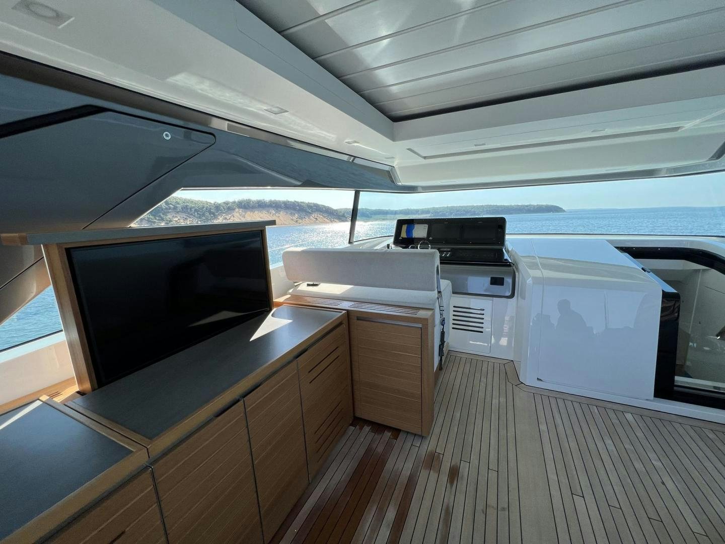 a room with a large flat screen tv and a large flat screen tv aboard Twenty One Yacht for Sale