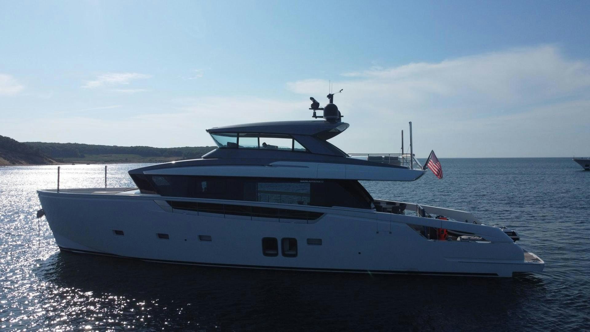 a white yacht on the water aboard Twenty One Yacht for Sale