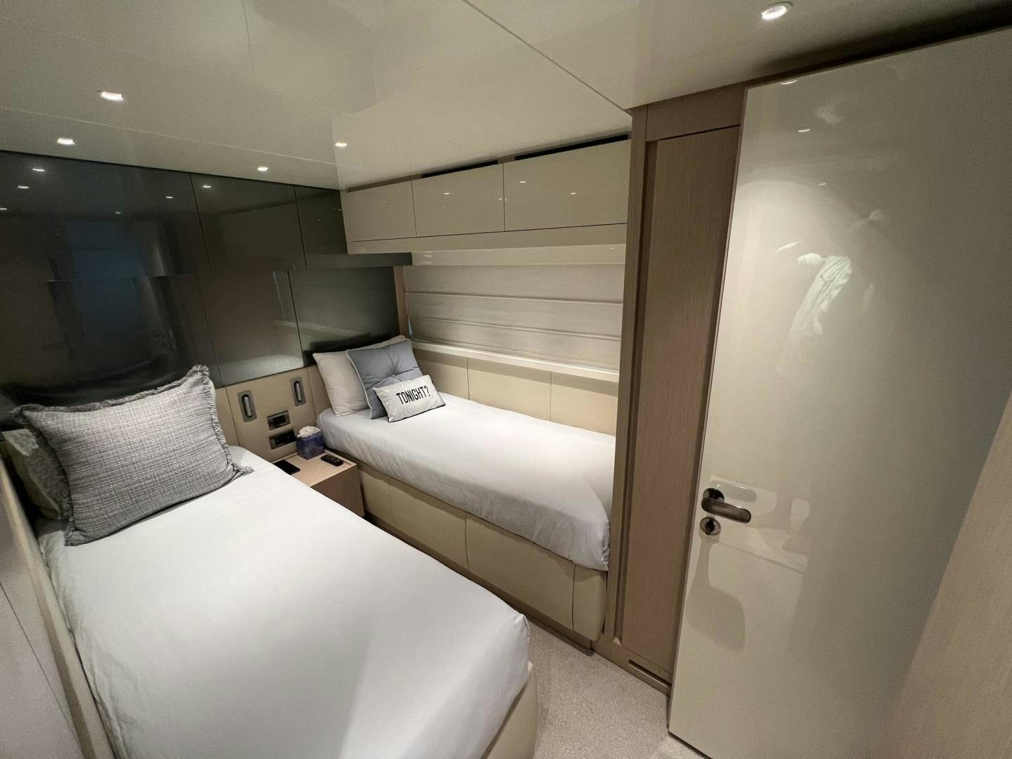 a room with two beds aboard Twenty One Yacht for Sale