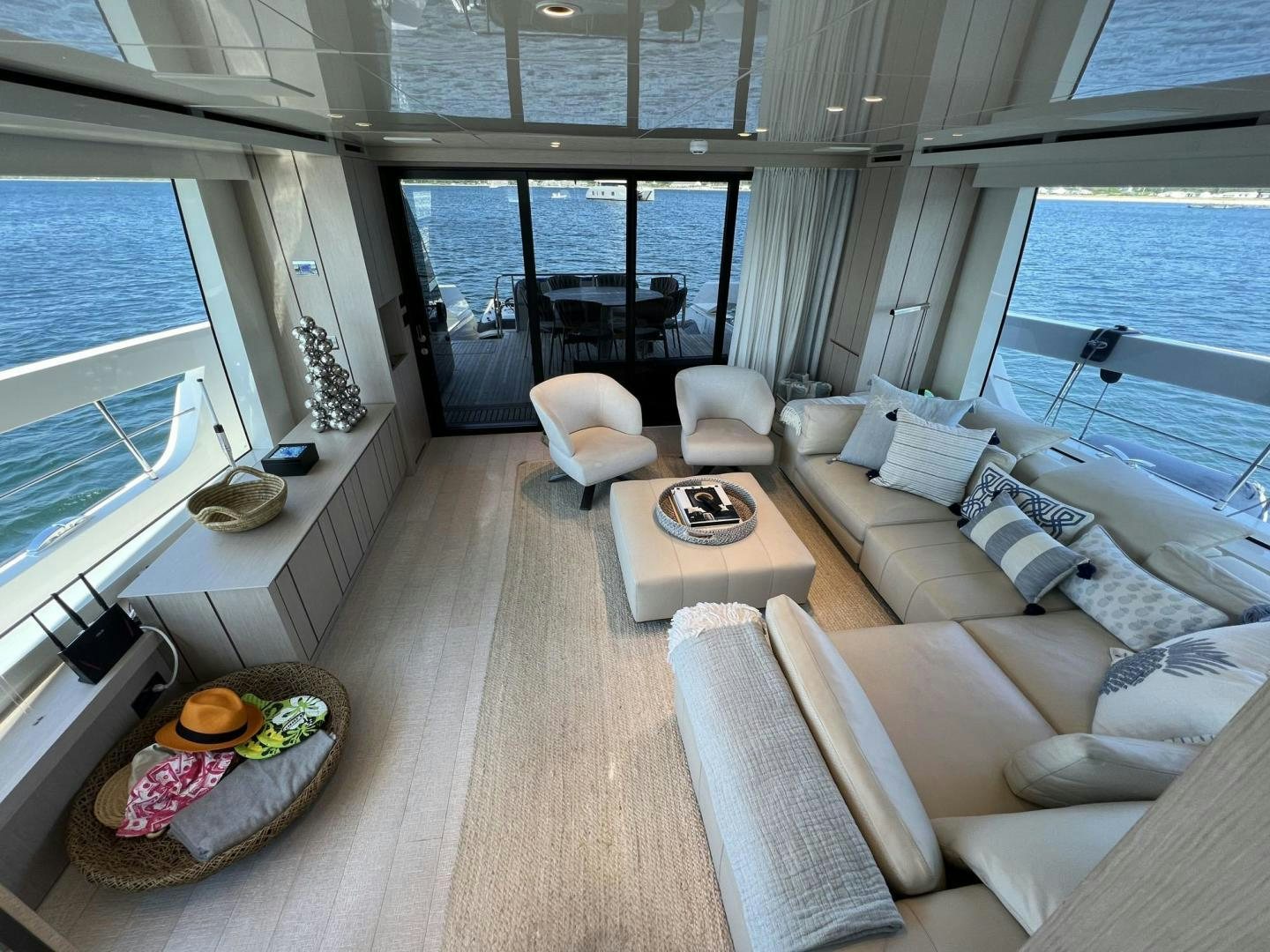 a living room with a large window aboard Twenty One Yacht for Sale