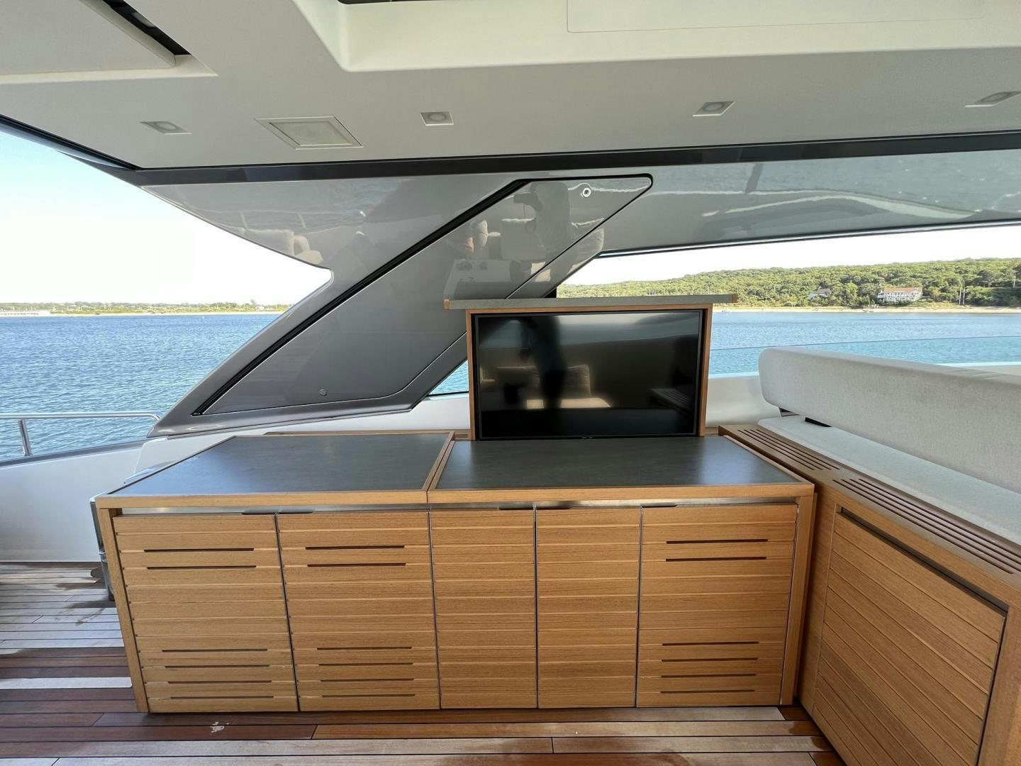 a room with a tv and a dresser aboard Twenty One Yacht for Sale