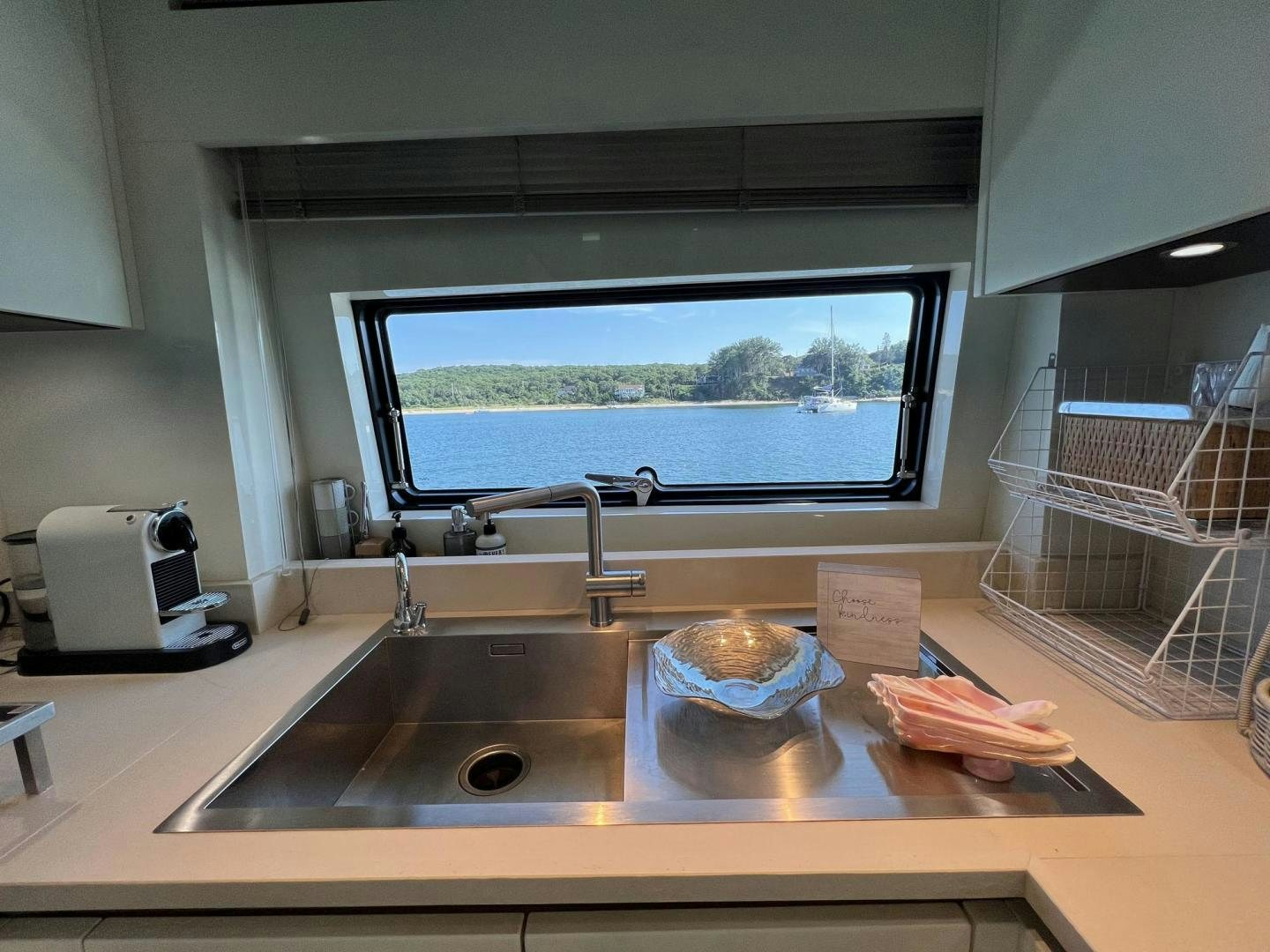 a kitchen with a large tv aboard Twenty One Yacht for Sale