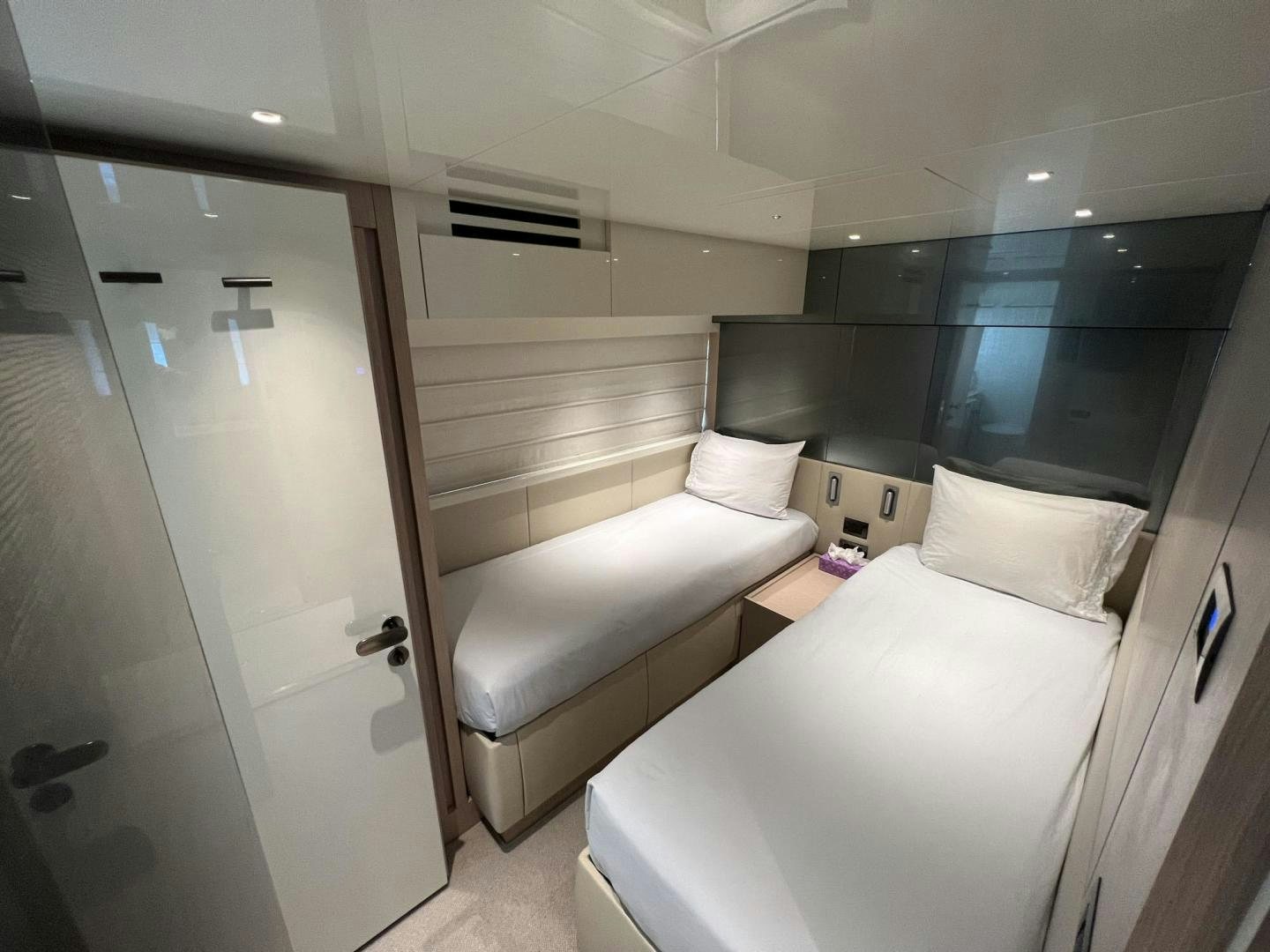 a room with a bed and a door aboard Twenty One Yacht for Sale