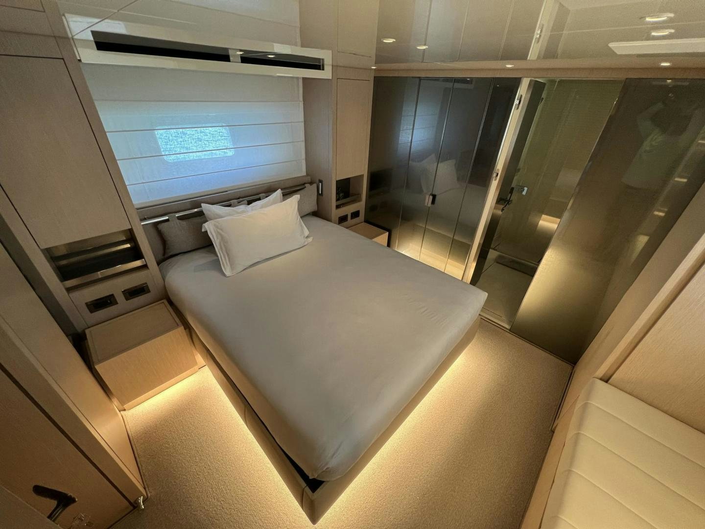 a room with a bed and a window aboard Twenty One Yacht for Sale