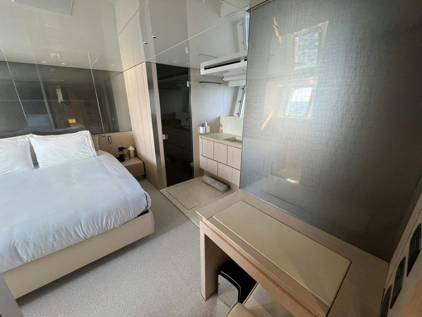 a room with a bed and a mirror aboard Twenty One Yacht for Sale