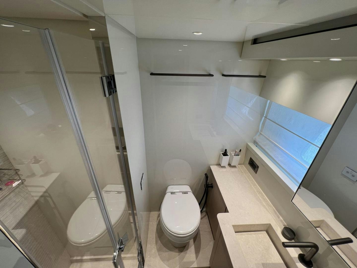 a bathroom with a glass shower aboard Twenty One Yacht for Sale