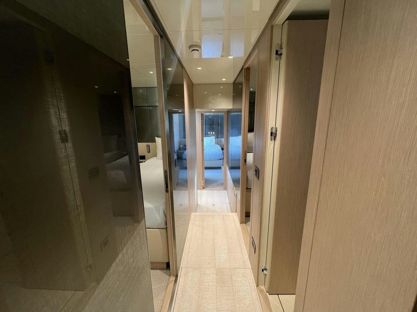 a hallway with doors aboard Twenty One Yacht for Sale