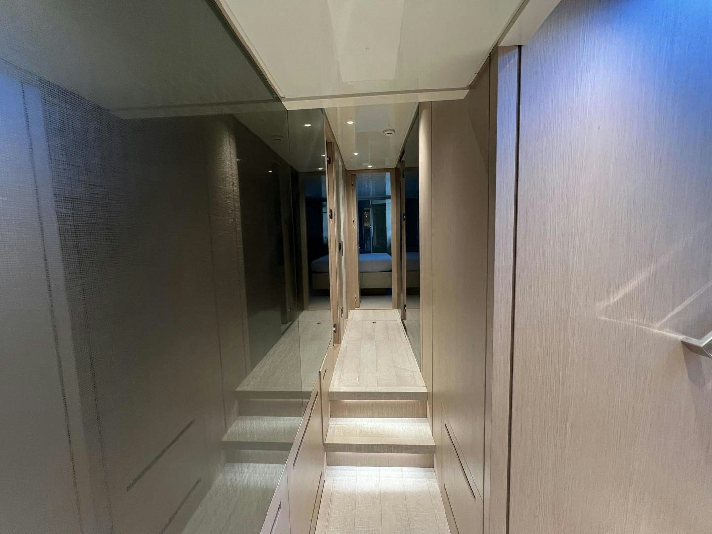 a hallway with doors aboard Twenty One Yacht for Sale