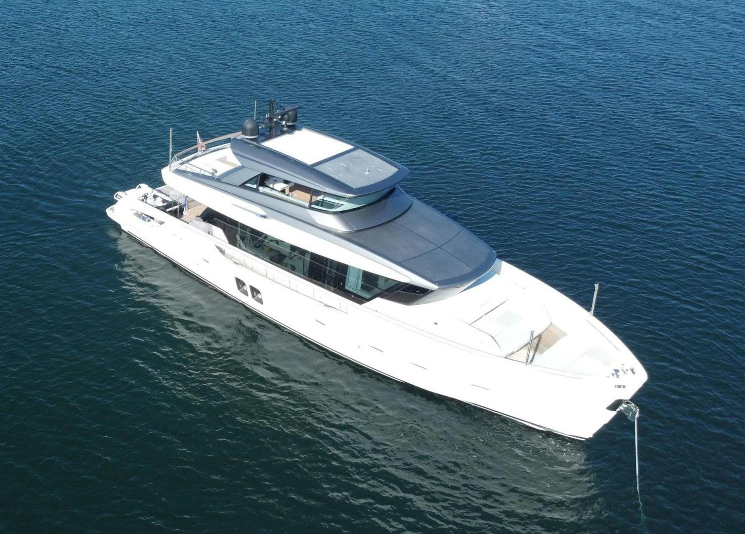 a white yacht on the water aboard Twenty One Yacht for Sale