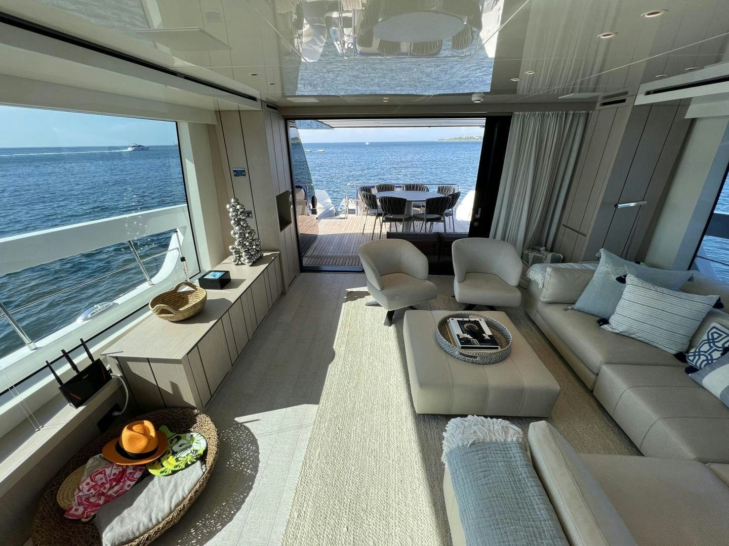 a living room with a large window aboard Twenty One Yacht for Sale