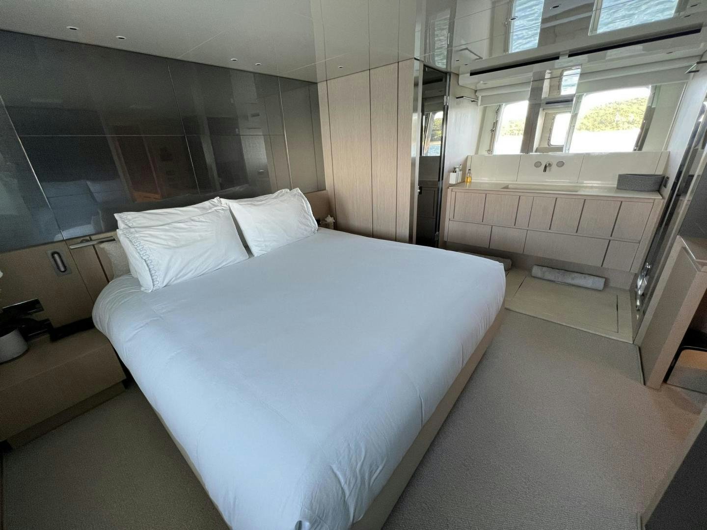 a room with a bed and a window aboard Twenty One Yacht for Sale