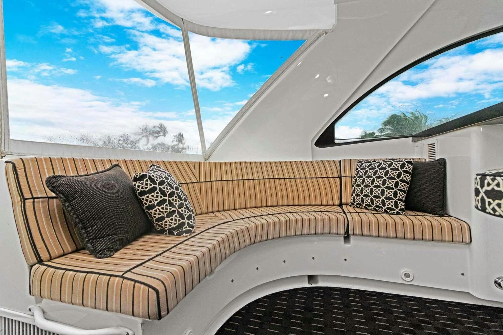 a white bed with pillows aboard SEMPER FI Yacht for Sale