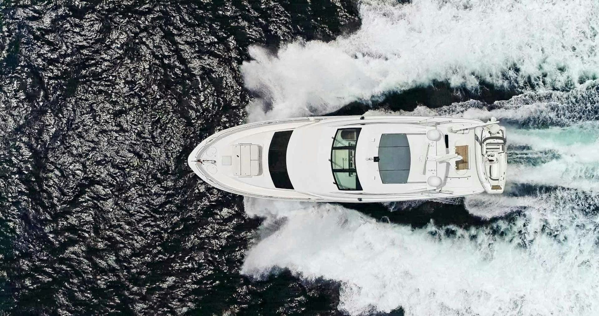 a car driving through a snowy mountain aboard SEMPER FI Yacht for Sale