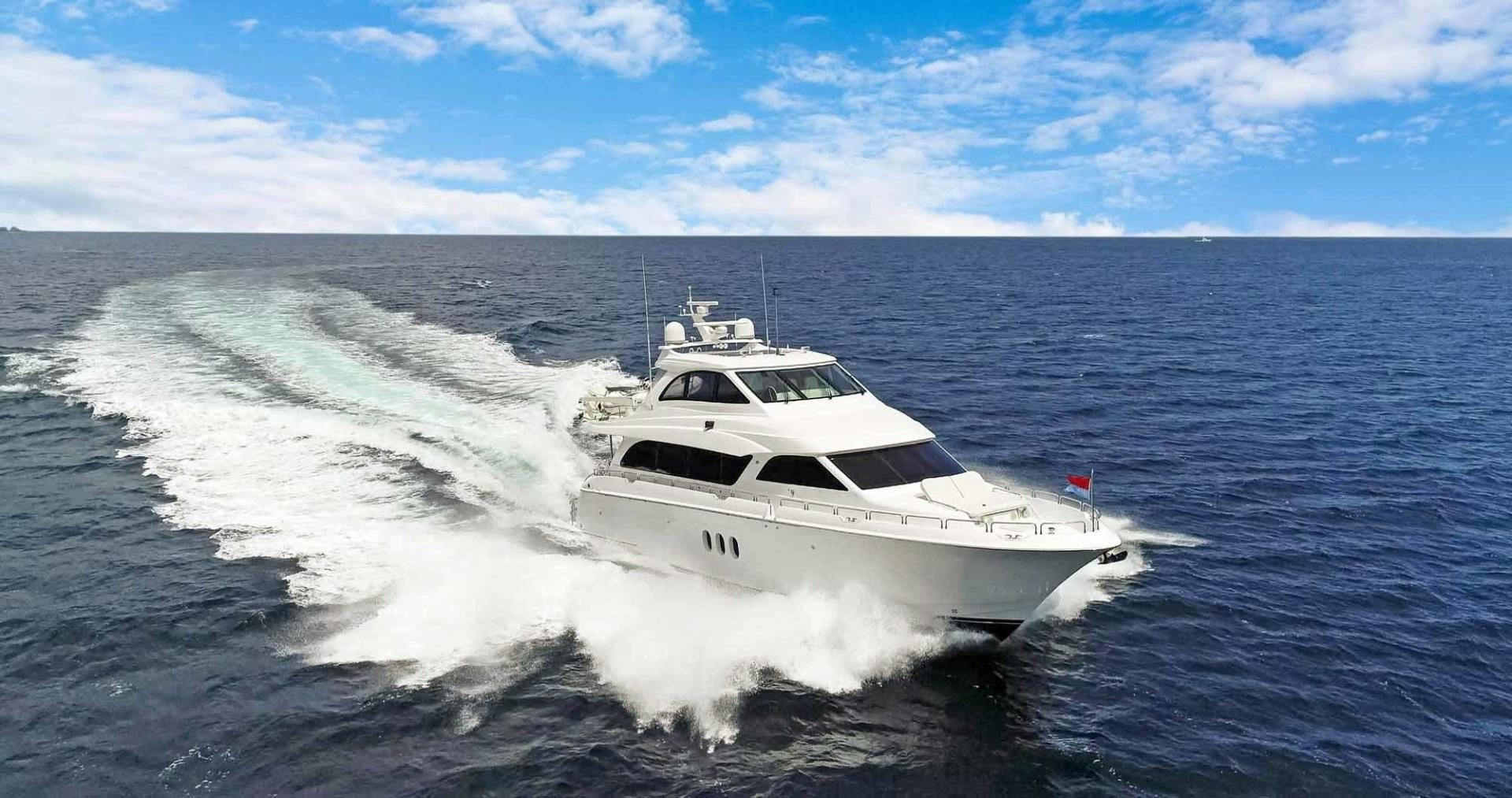 a white yacht on the water aboard SEMPER FI Yacht for Sale