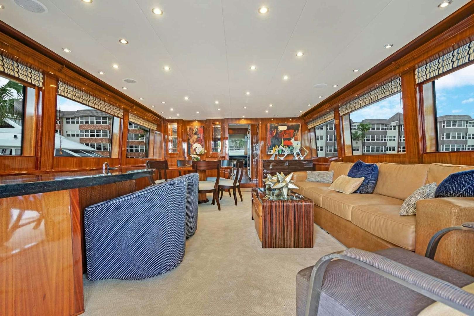 a living room with a couch and a coffee table aboard SEMPER FI Yacht for Sale