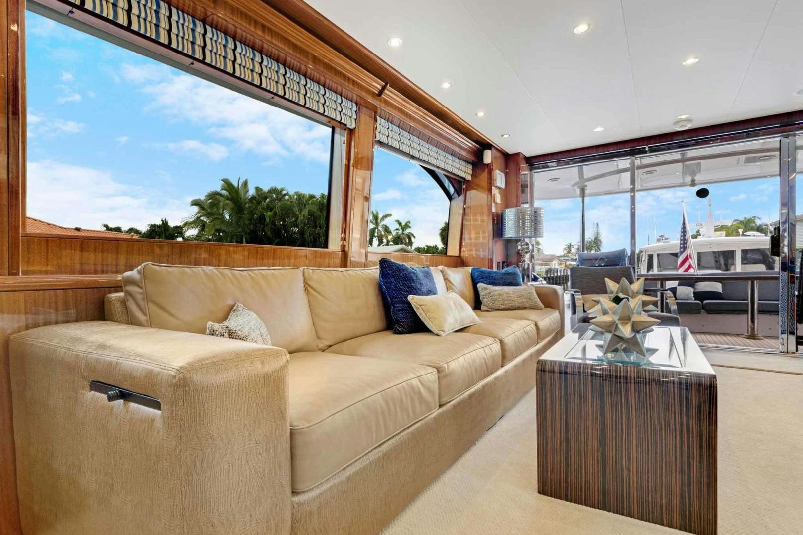 a living room with a large window aboard SEMPER FI Yacht for Sale