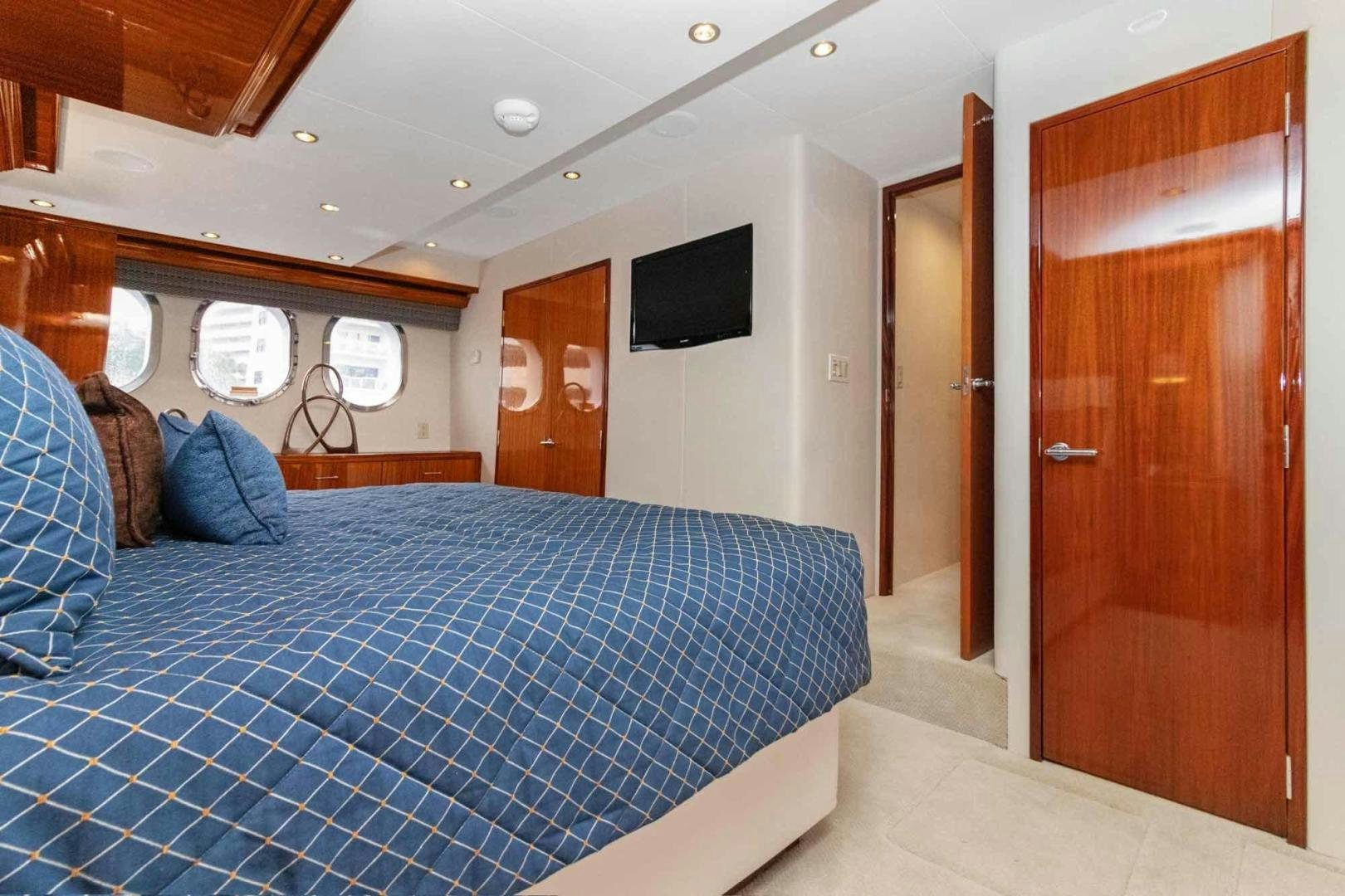 a bed in a room aboard SEMPER FI Yacht for Sale