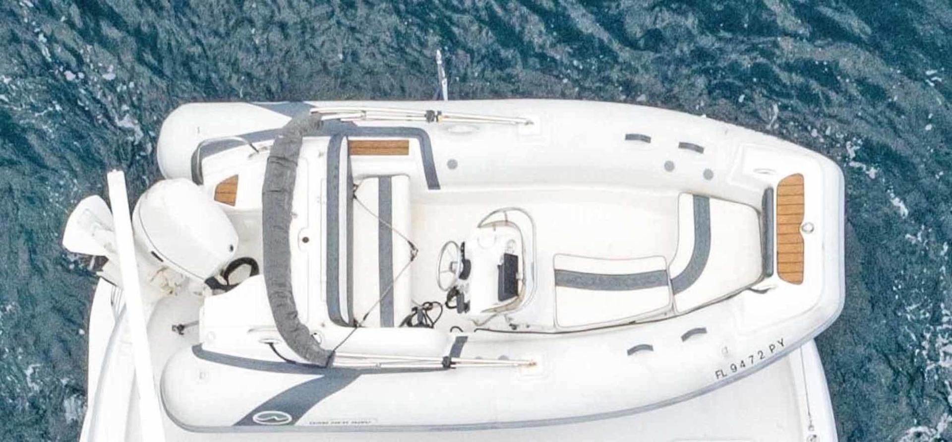 a white vehicle in the snow aboard SEMPER FI Yacht for Sale