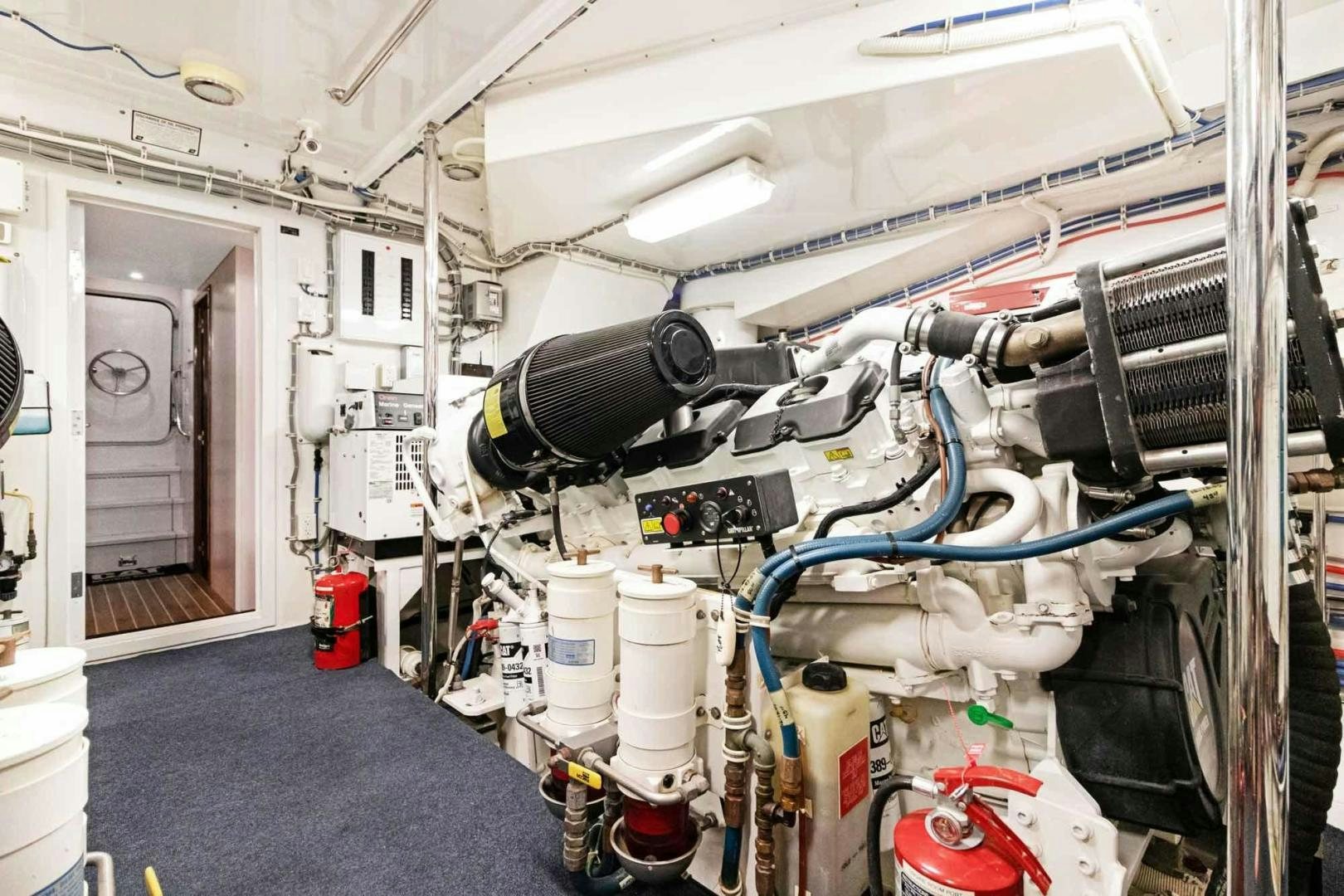 a machine in a room aboard SEMPER FI Yacht for Sale