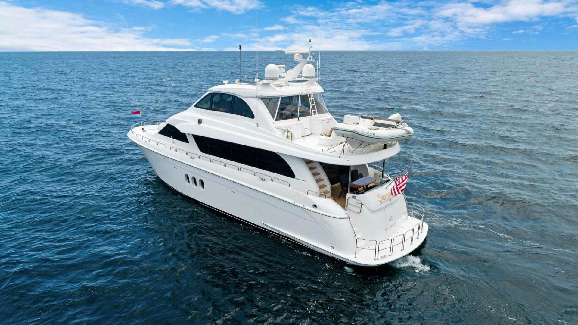 a white yacht in the water aboard SEMPER FI Yacht for Sale