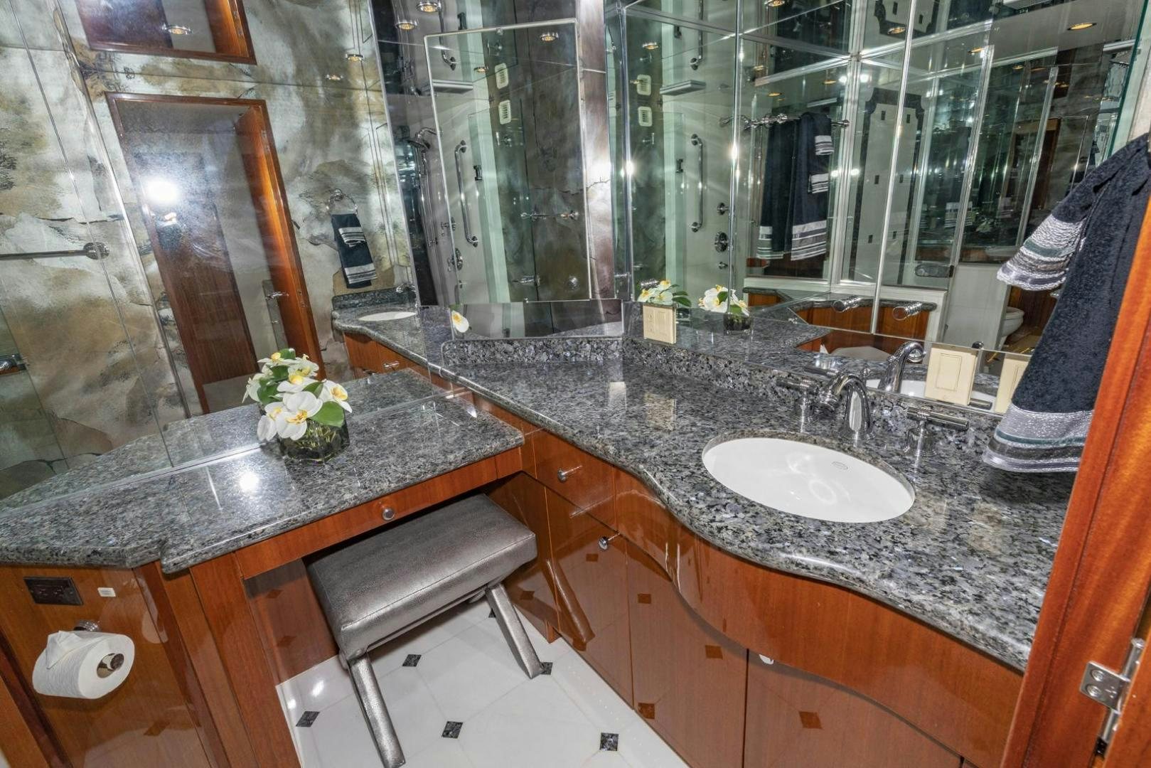 a bathroom with a large marble countertop aboard SEMPER FI Yacht for Sale