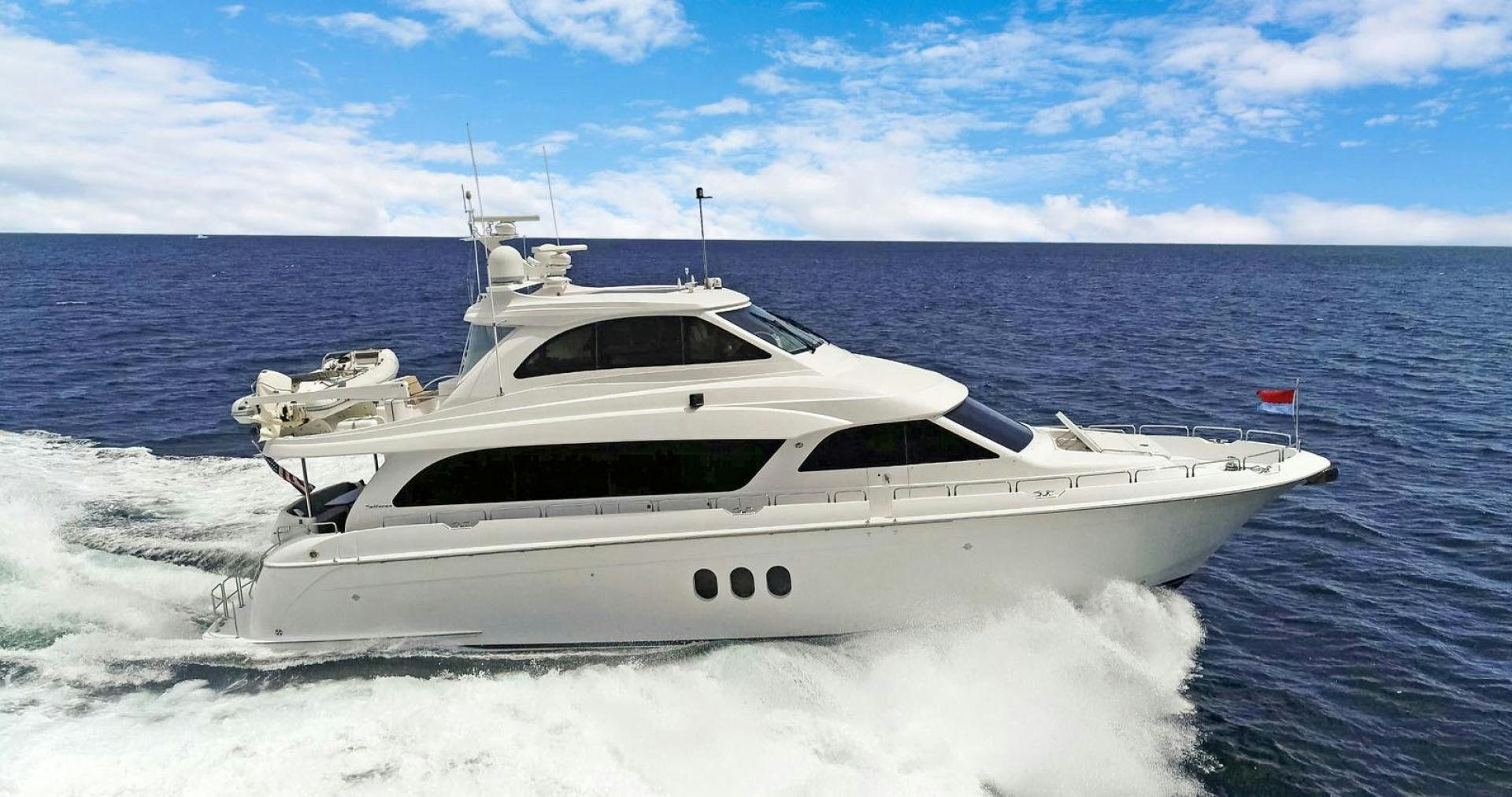 a white yacht on the water aboard SEMPER FI Yacht for Sale