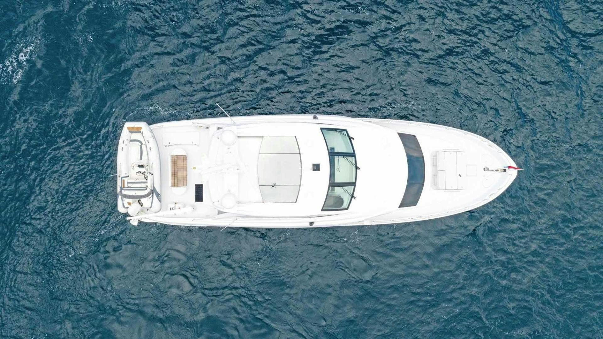 a white boat in the water aboard SEMPER FI Yacht for Sale