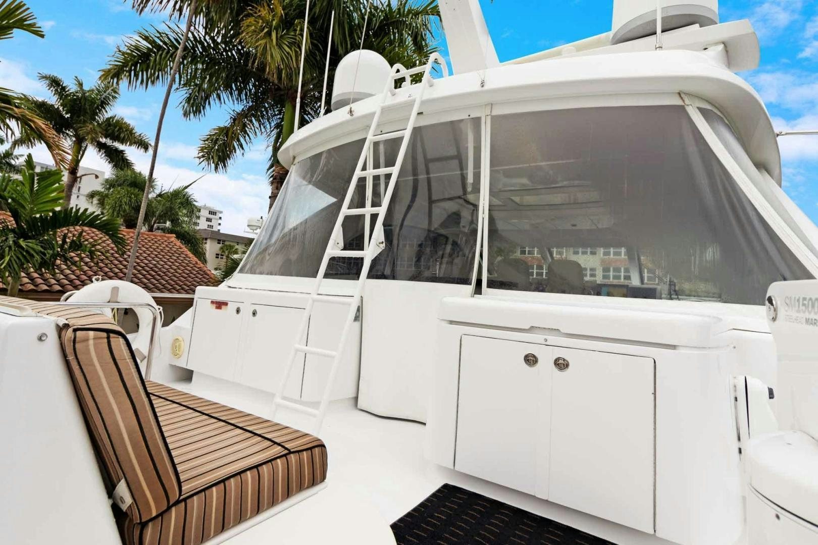 a white boat with a deck aboard SEMPER FI Yacht for Sale