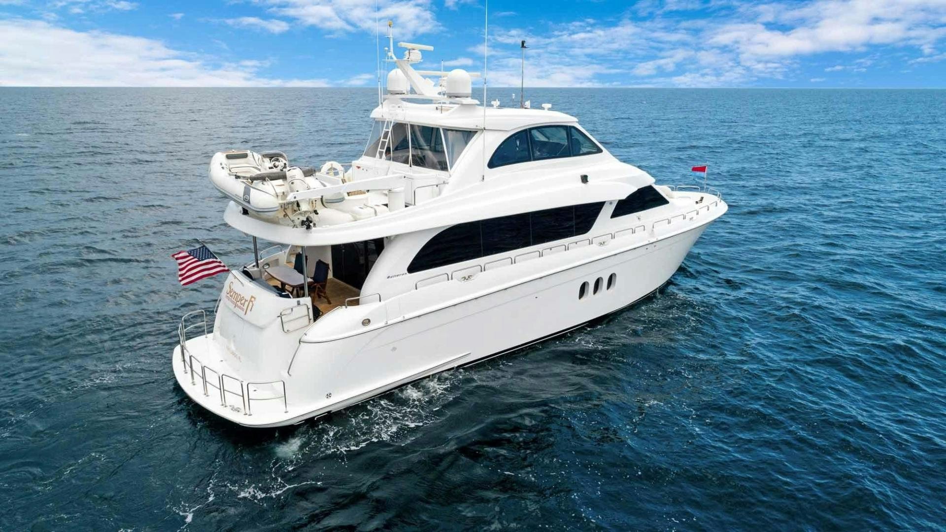 a white yacht in the water aboard SEMPER FI Yacht for Sale