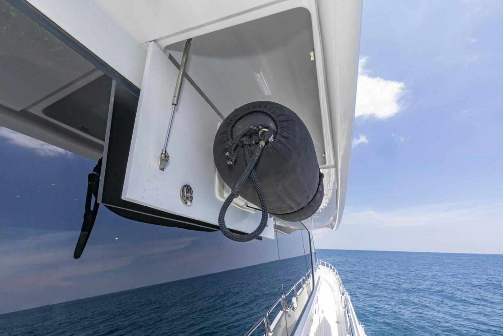 a boat with a helmet on the front aboard SEMPER FI Yacht for Sale