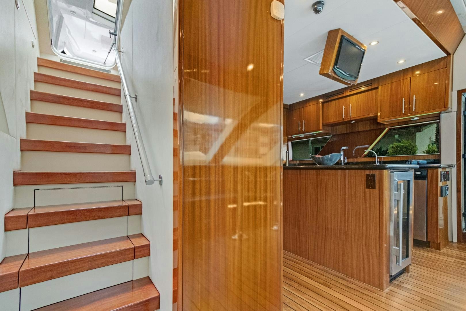 a kitchen with wooden cabinets aboard SEMPER FI Yacht for Sale