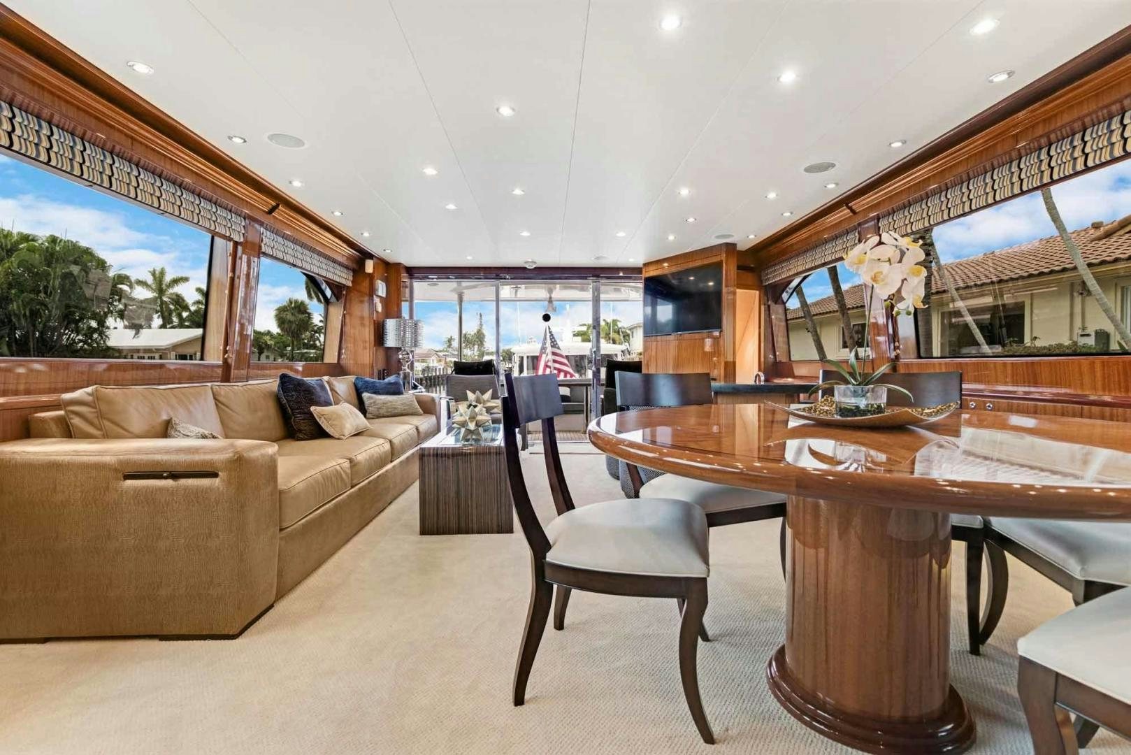 a living room with a couch and a table aboard SEMPER FI Yacht for Sale
