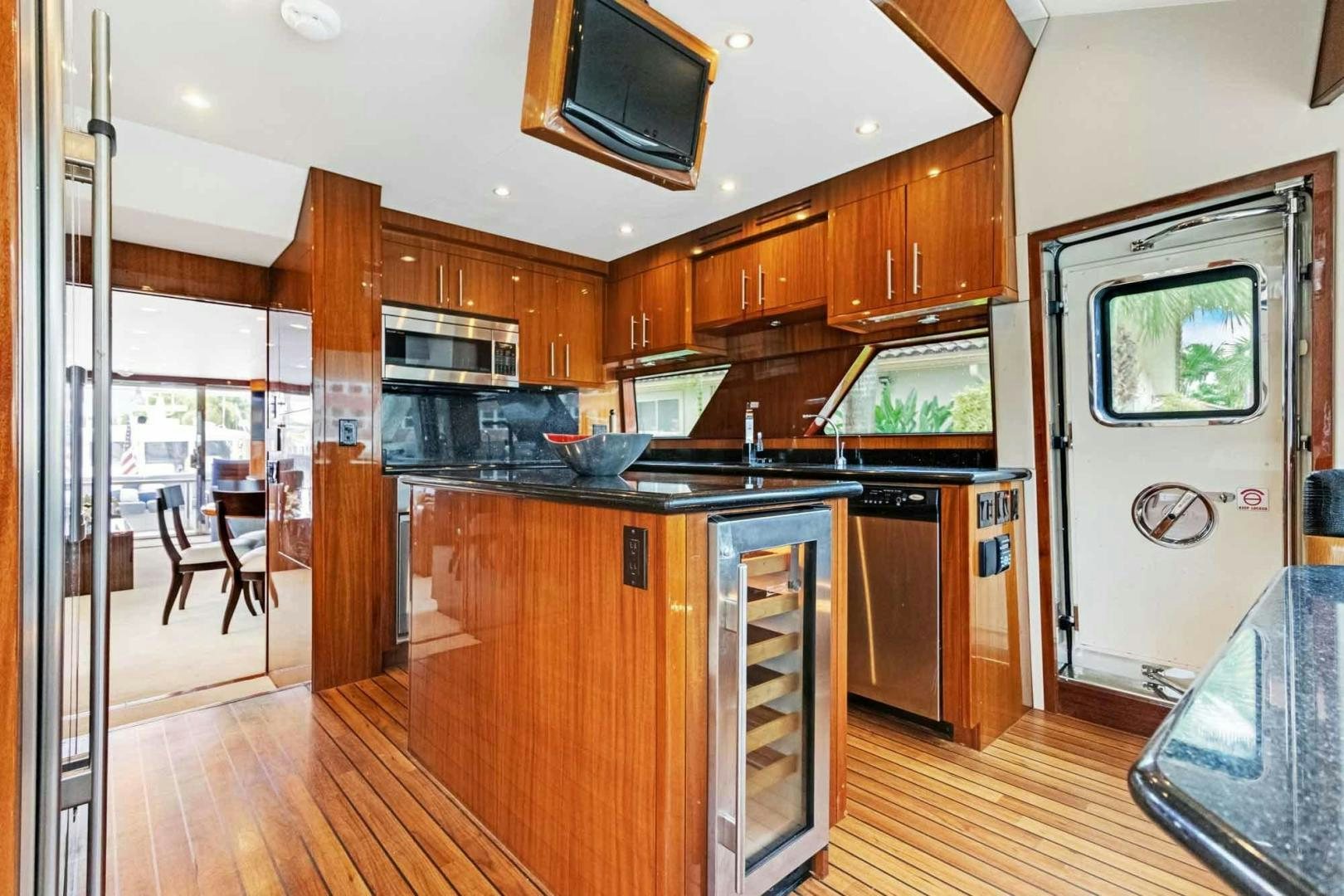a kitchen with wooden cabinets aboard SEMPER FI Yacht for Sale