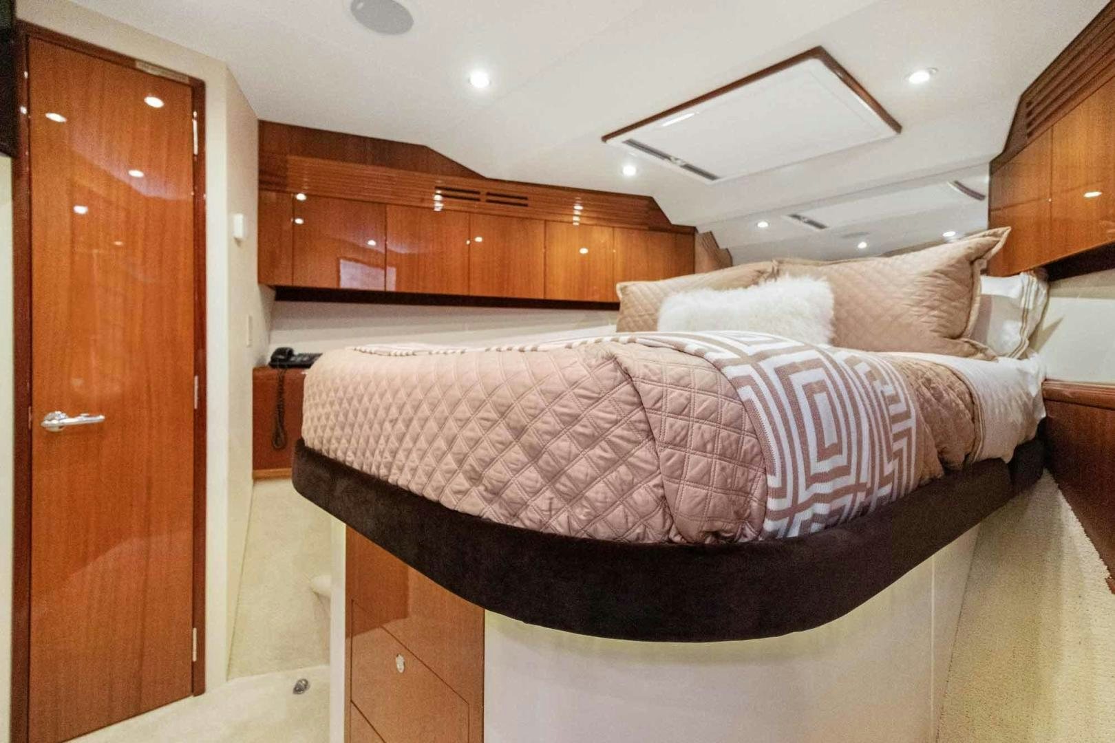 a bed in a room aboard SEMPER FI Yacht for Sale