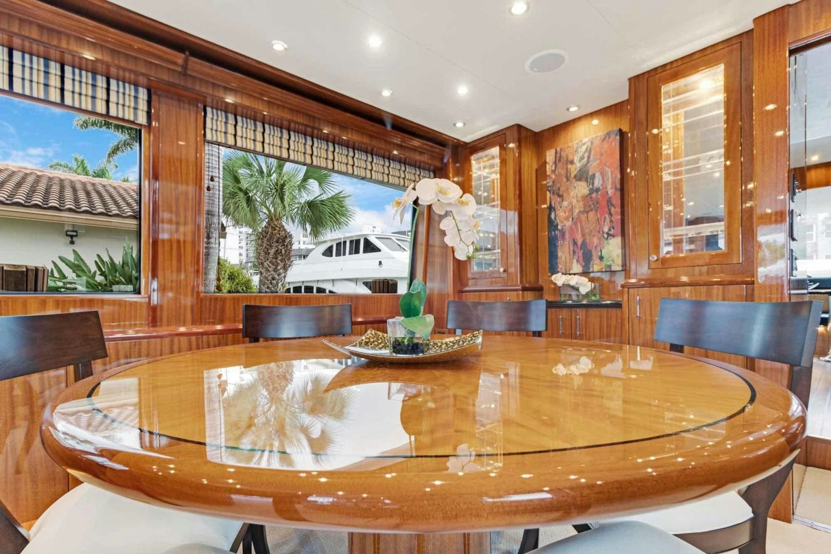 a dining table in a room aboard SEMPER FI Yacht for Sale