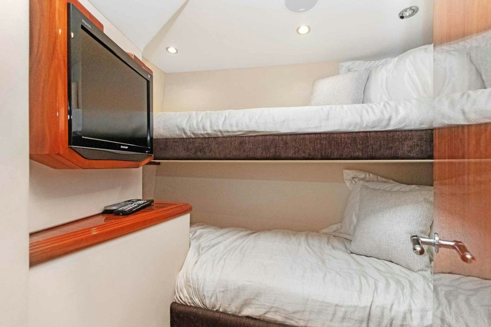 a bed with a television on top of it aboard SEMPER FI Yacht for Sale