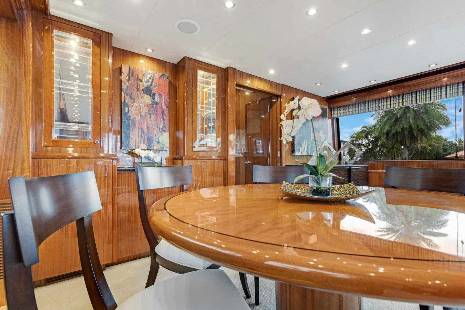 a dining table in a room aboard SEMPER FI Yacht for Sale